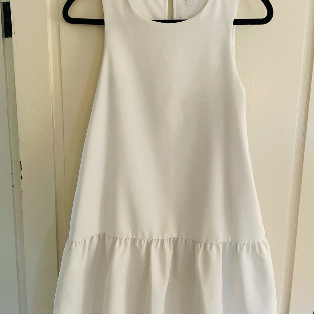 White dress with pockets.